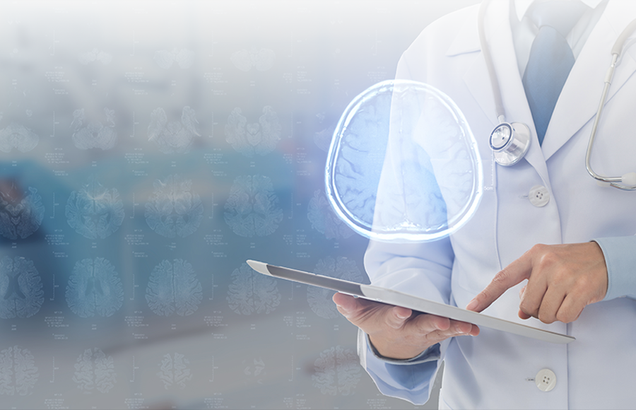 Doctor looking at a brain on a tablet